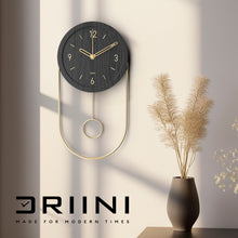 Load image into Gallery viewer, Driini Decorative Modern Wall Clock with Pendulum (Black)