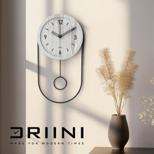 Load image into Gallery viewer, Driini Decorative Modern Wall Clock with Pendulum (White)