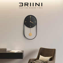 Load image into Gallery viewer, Driini Modern Pendulum Wall Clock - Decorative and Unique Metal Frame, with 8 Inch Face (Black)